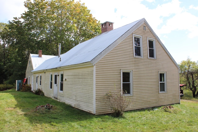 view of property exterior featuring a lawn