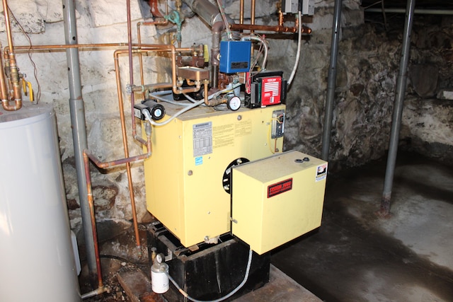 utility room featuring gas water heater