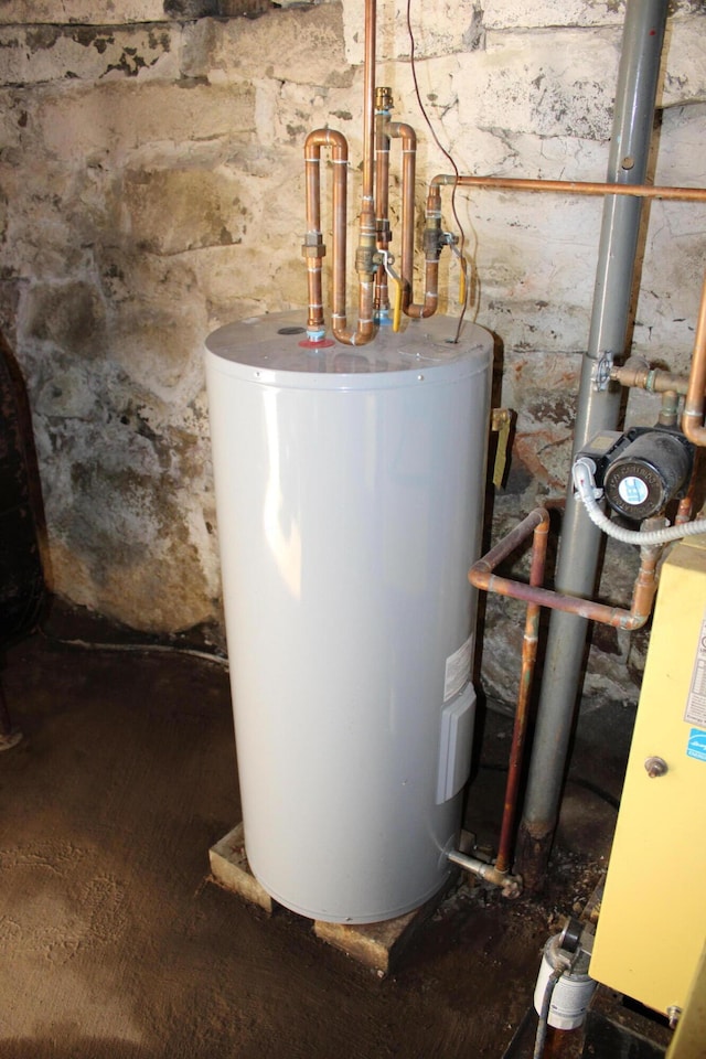 utility room with electric water heater