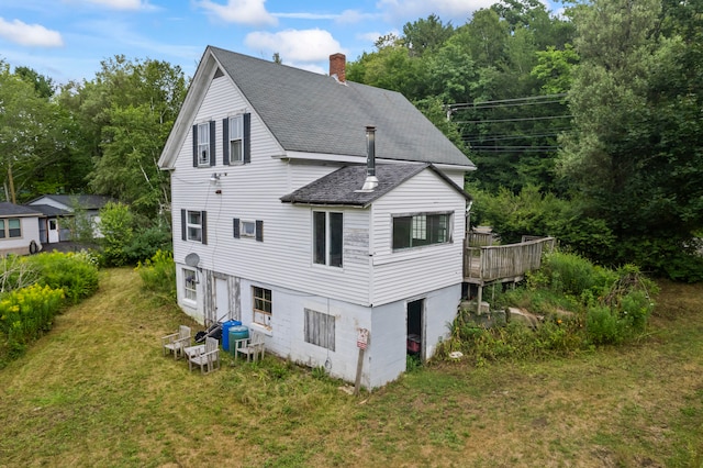 view of home's exterior with a lawn