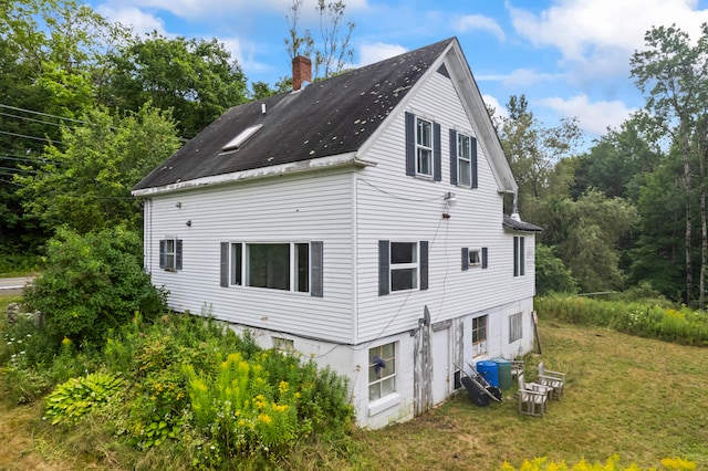 view of property exterior featuring a yard