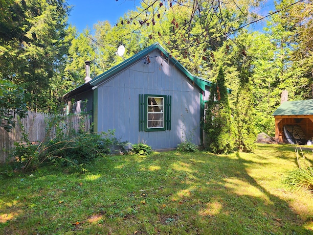 view of home's exterior featuring a yard