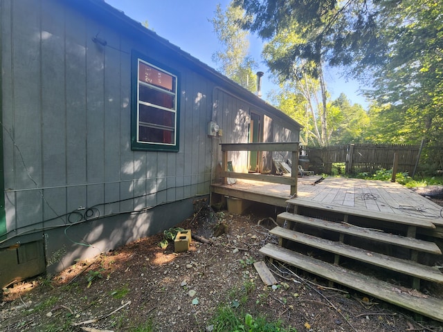 back of property featuring a wooden deck