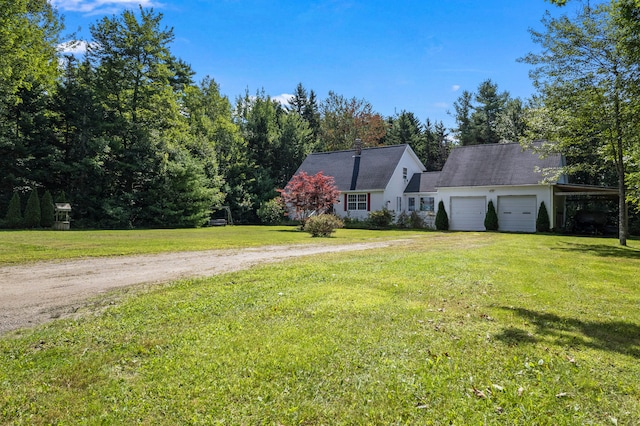 view of front of house with a garage and a front yard