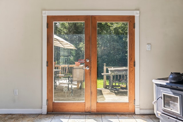 doorway to outside featuring plenty of natural light and light tile patterned flooring