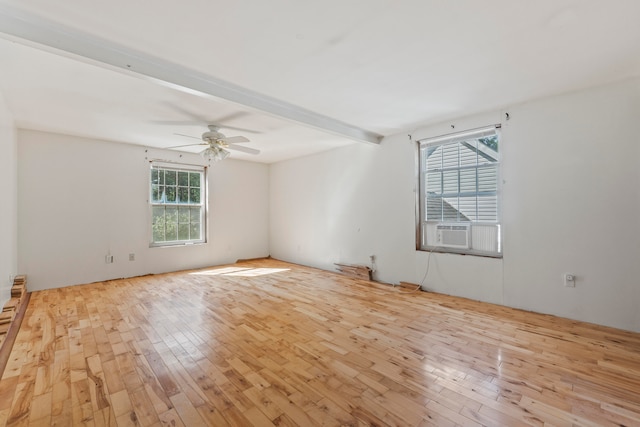 unfurnished room with ceiling fan, cooling unit, beamed ceiling, and light hardwood / wood-style floors