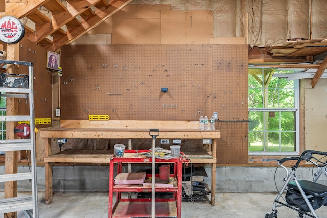 interior space featuring a workshop area and concrete floors