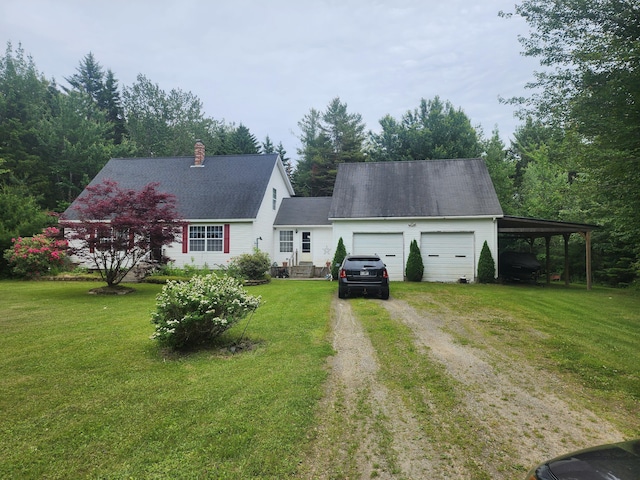 new england style home with a front lawn, a carport, and a garage