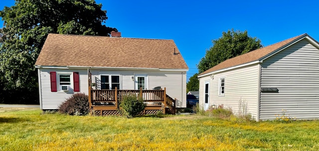 back of property featuring cooling unit, a wooden deck, and a yard