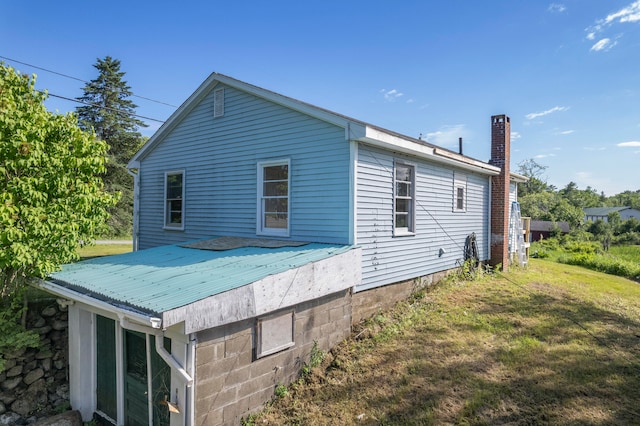 view of property exterior featuring a yard