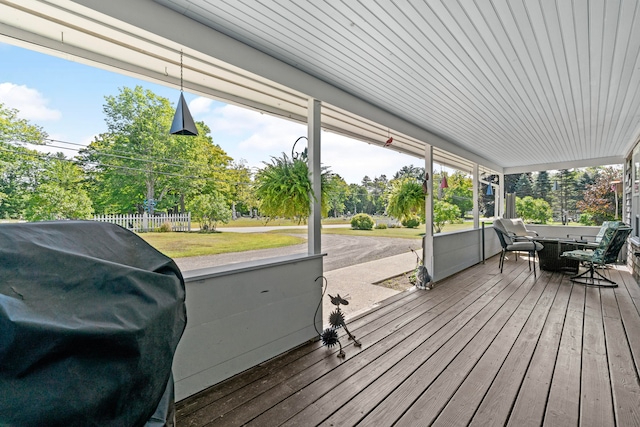 wooden terrace featuring grilling area