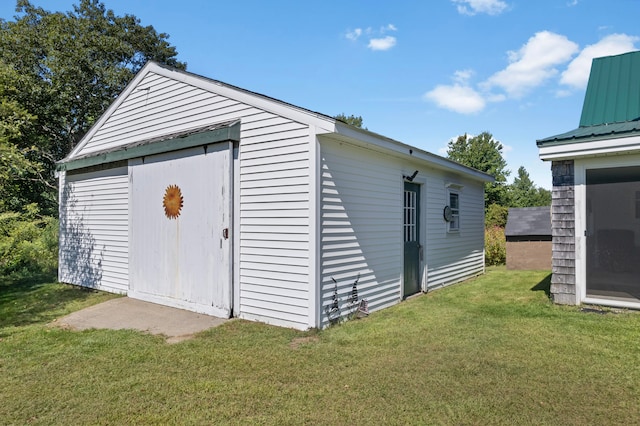 garage featuring a lawn