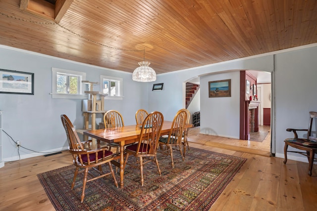 dining space with wooden ceiling and light hardwood / wood-style floors