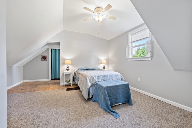 carpeted bedroom with ceiling fan and lofted ceiling