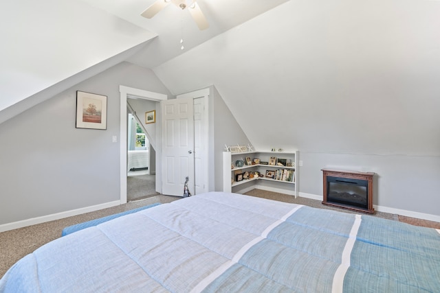 bedroom featuring ceiling fan, lofted ceiling, and carpet