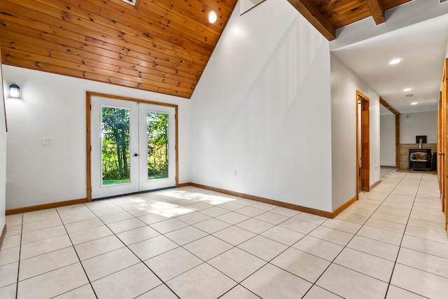 unfurnished room with french doors, light tile patterned floors, high vaulted ceiling, and wooden ceiling