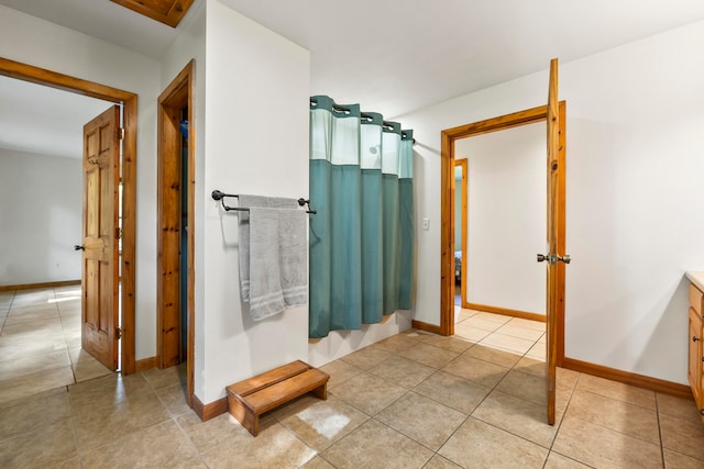 bathroom featuring vanity and tile patterned flooring