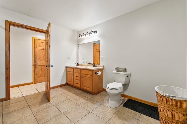 bathroom featuring vanity, toilet, and tile patterned floors