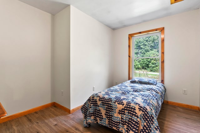 bedroom featuring wood-type flooring