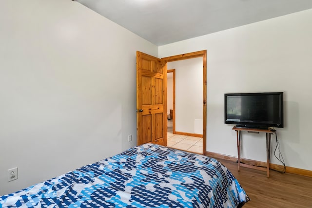 bedroom with light wood-type flooring