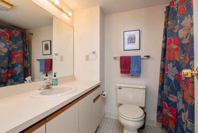 bathroom featuring vanity, a textured ceiling, a shower with shower curtain, toilet, and tile patterned floors