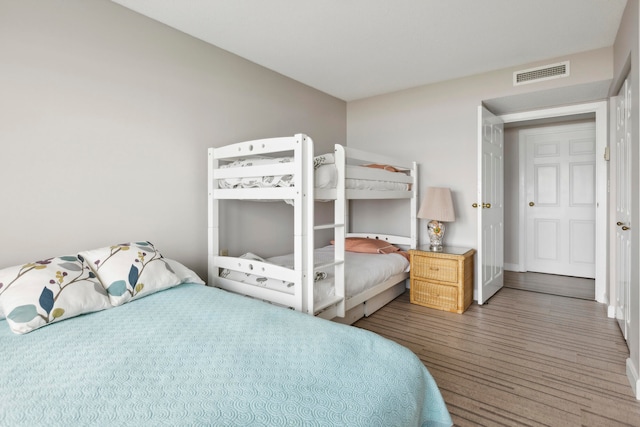 bedroom with wood-type flooring