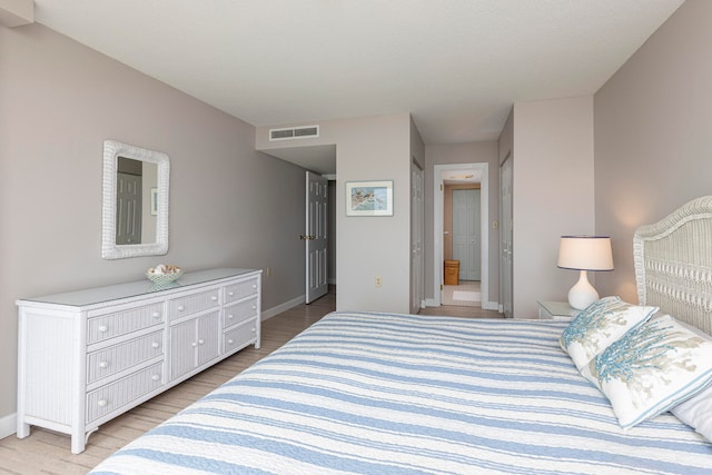 bedroom featuring light wood-type flooring