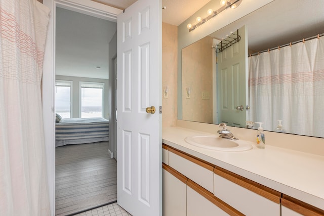 bathroom with wood-type flooring and vanity