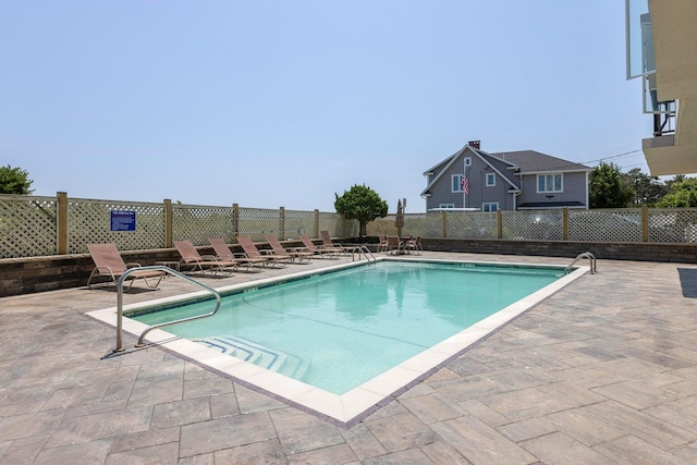 view of swimming pool with a patio