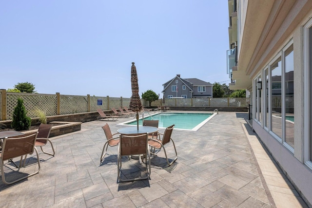 view of swimming pool featuring a patio