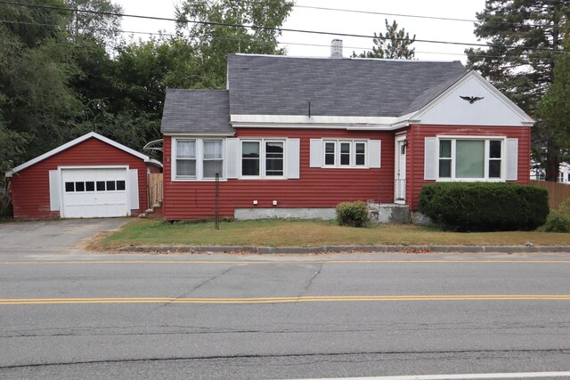 view of front of home with an outdoor structure and a garage