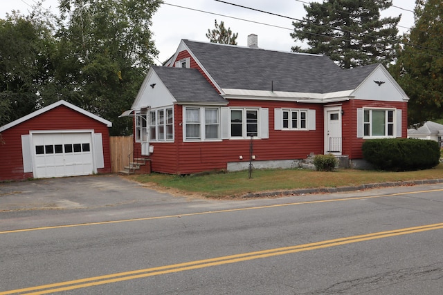 view of front of home with an outbuilding and a garage