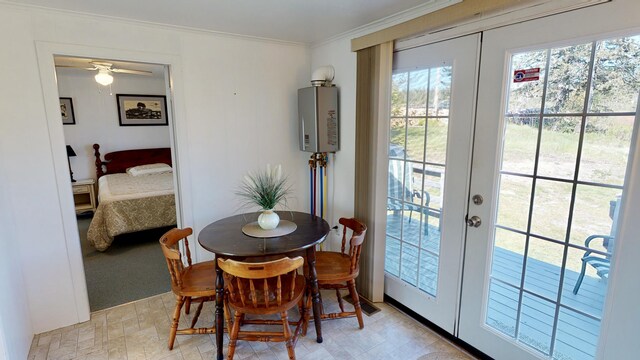 dining space featuring ornamental molding and french doors