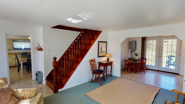 interior space featuring water heater and french doors