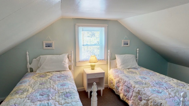 bedroom featuring vaulted ceiling and carpet