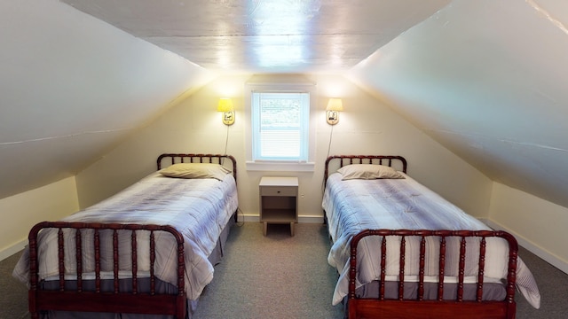 carpeted bedroom with lofted ceiling