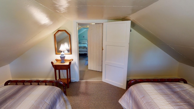 carpeted bedroom featuring vaulted ceiling