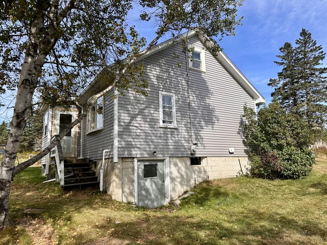 view of home's exterior featuring a yard