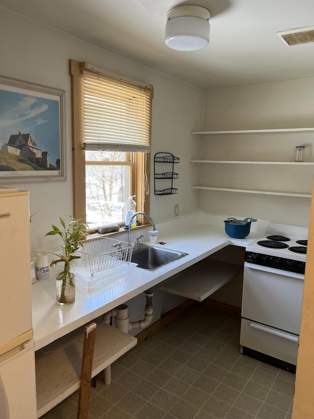 kitchen featuring sink and white appliances