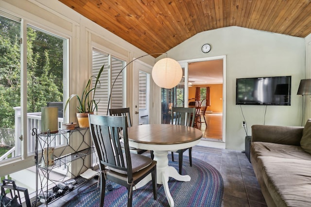 interior space with vaulted ceiling, wooden ceiling, and a healthy amount of sunlight