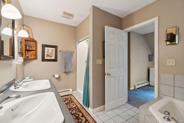 bathroom with tile patterned flooring, sink, and a baseboard radiator