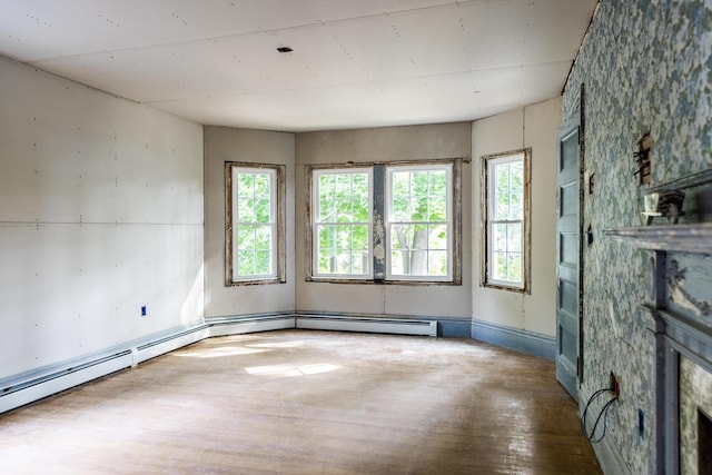 unfurnished living room featuring wood finished floors