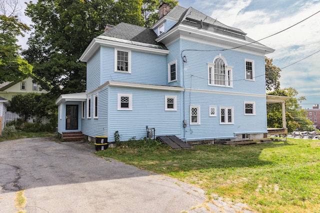 exterior space with a front yard