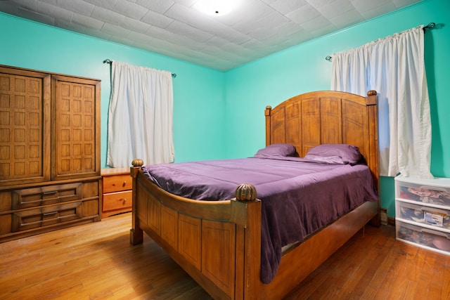 bedroom with light hardwood / wood-style floors