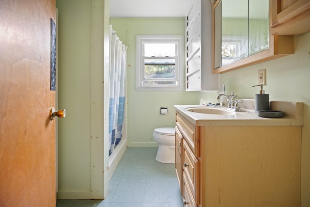 bathroom with vanity, toilet, and a shower with shower curtain