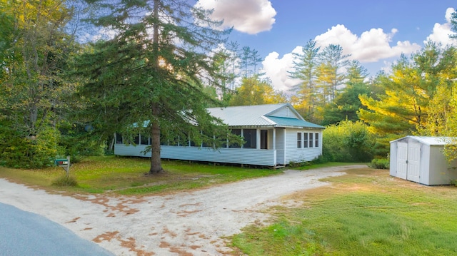 exterior space with a shed and a lawn