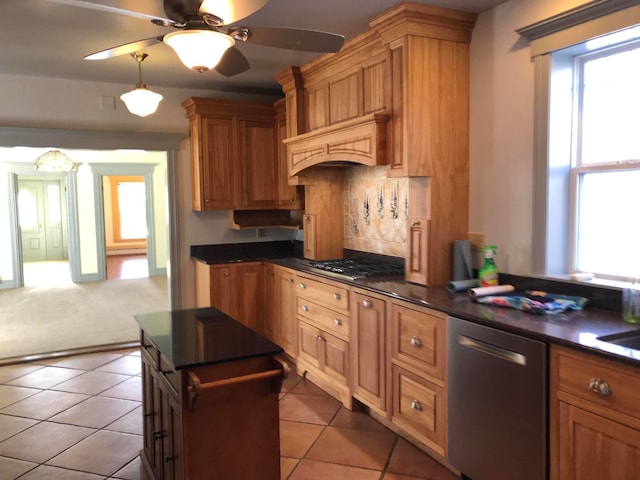 kitchen with light tile patterned flooring, custom exhaust hood, decorative backsplash, appliances with stainless steel finishes, and ceiling fan