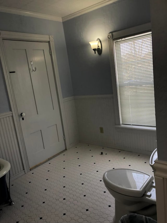 bathroom featuring ornamental molding and tile patterned floors