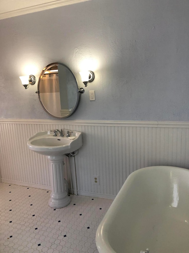 bathroom featuring tile patterned flooring and a bathing tub