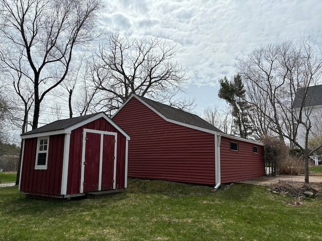 view of outdoor structure with a lawn